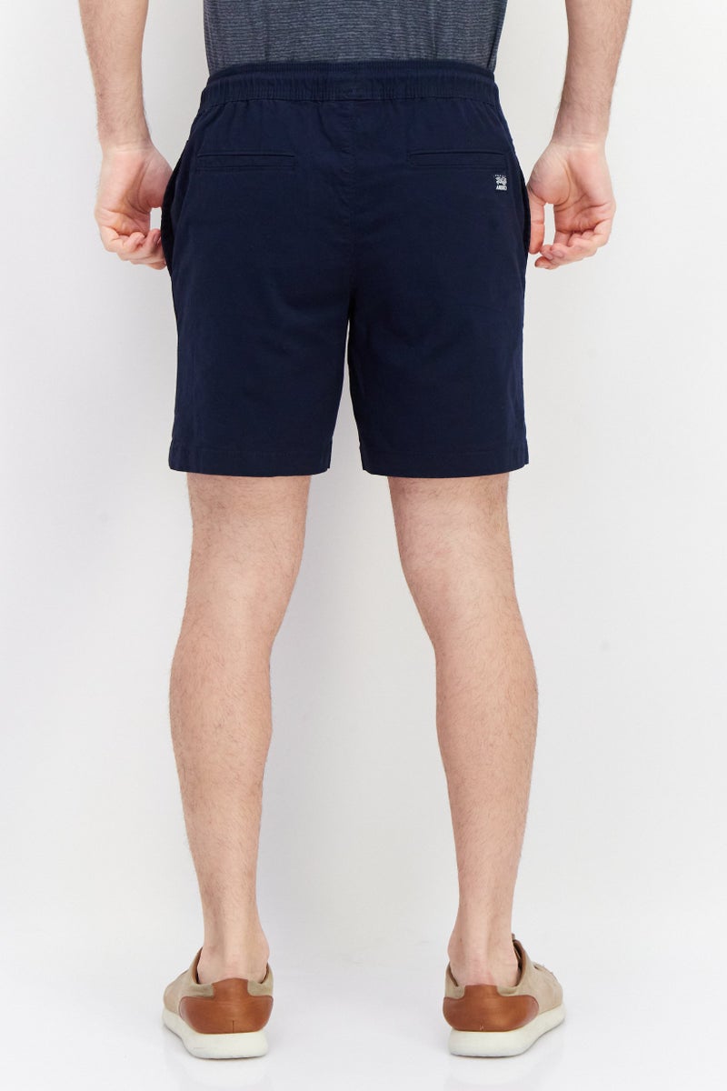 PERRY ELLIS شورتات تشينو صلبة للرجال بطول 9 إنش، كحلي - Image 2